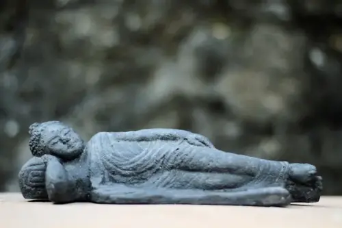 Product image of the product “Lying Buddha, 24cm long - Interior ca.23,5x9x8cm, andesite cast, antique finish ”