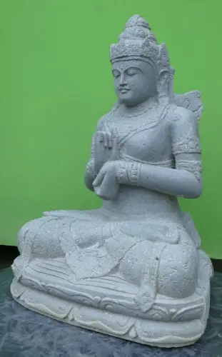 Product image of the product “Seated Dewi Sri made of Riverstone in Dharmachakra gesture of wheel of the teaching of the Dharma, H. 80cm. ”