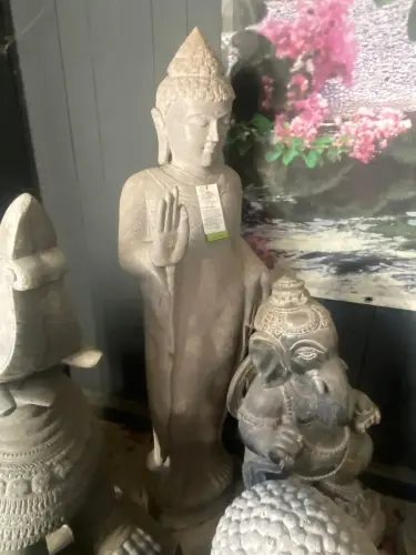 Product image of the product “Standing Buddha with floral carving, Abudaya position. 37 x 32 x 152cm. Natural stone (river stone), stonemasonry ”