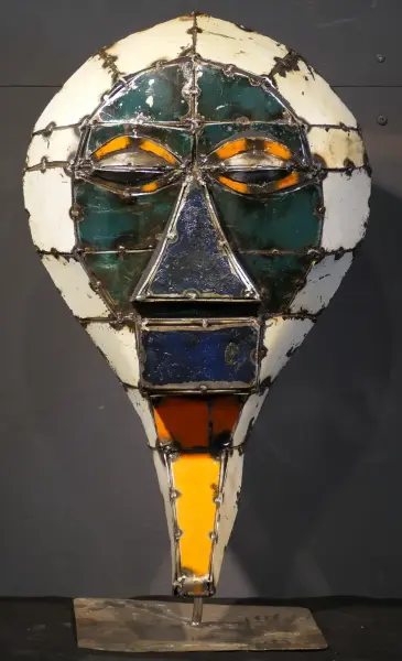 Product image 1 of the product “Small Mask on stand - Model 3, 50cm height, sculpture from upcyceled oil barrel ”