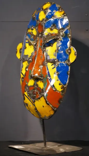 Product image 2 of the product “Small Mask on stand - Model 1, 50cm height, sculpture from upcyceled oil barrel ”